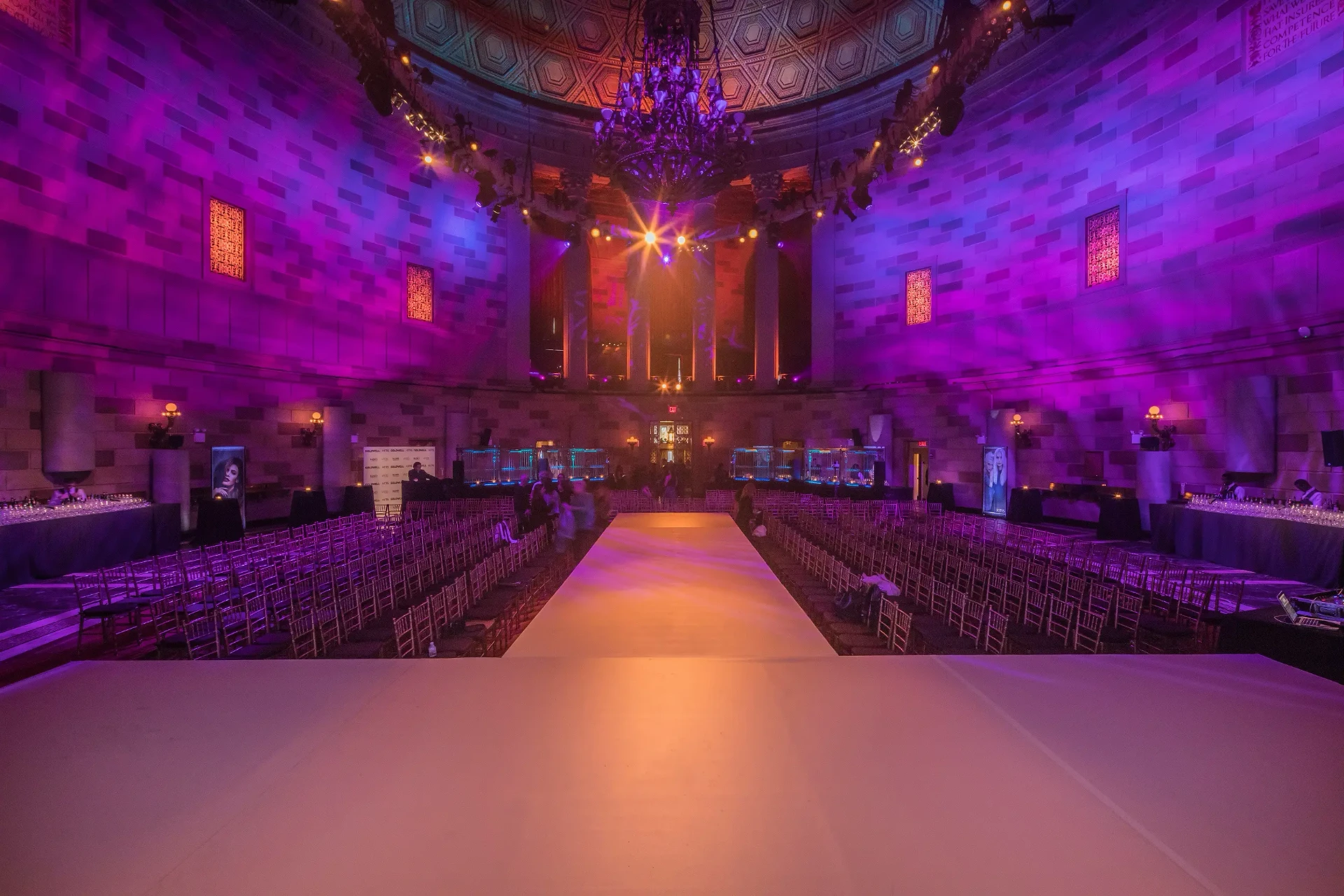 A modern gala underway beneath the glowing stained-glass dome